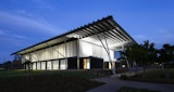 Night exterior of the Aboriginal and Islander Independent Community School (AIICS) Hall.