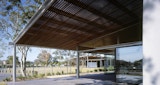 Flexible learning space showing open glass panel walls to exterior covered space as part of the completed Aboriginal and Islander Independent Community School (AIICS) designed by KIRK studio.