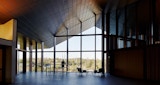 Internal arch window inside advanced engineering building looking outward over campus.