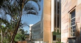 Path leading up to the Learning innovation building on the University of Queensland Campus, landscaped garden on either side of pathway. Architectural design by KIRK Studio.